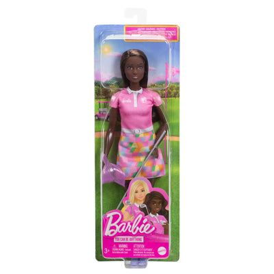 Barbie doll in packaging with pink dress and golf club on a white background