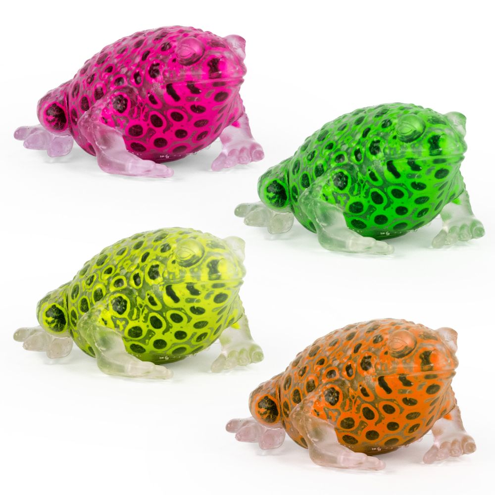 A collection of four colorful frog-shaped sensory toys in pink, green, orange, and yellow, made from a translucent material with black beads inside.