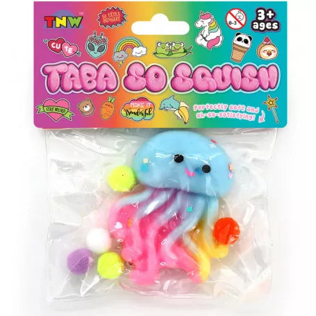 A packaged squishy toy shaped like a smiling jellyfish, shown in a clear plastic bag with a colorful printed header card. The jellyfish has a light blue head and pink, yellow, and orange tentacles, with small pom-pom accents.