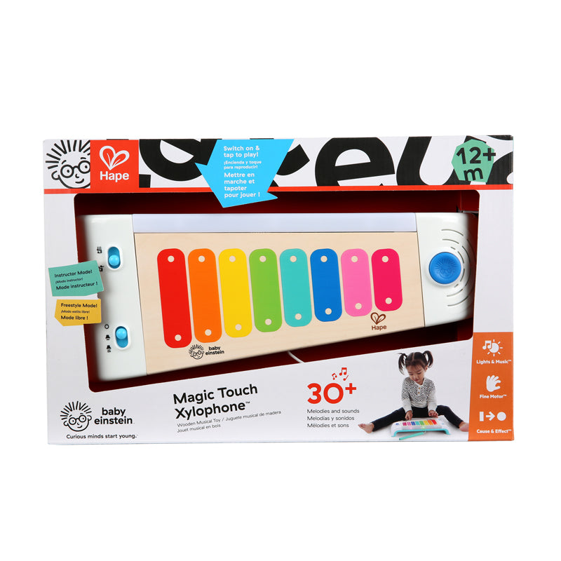 Baby Einstein Magic Touch Xylophone in wooden form with colorful keys, packaged in a box, with a child's silhouette playing the xylophone on the front.